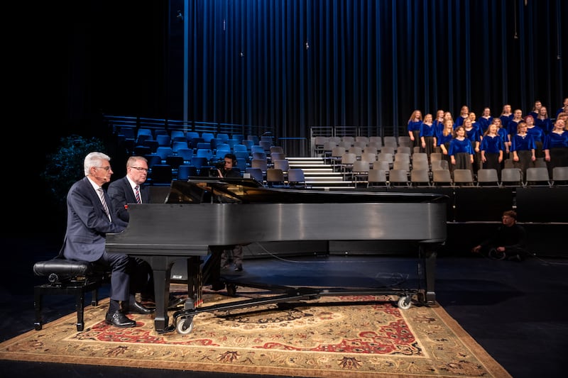 Elder Gérald Caussé of the Quorum of the Twelve Apostles helps accompany the choir during a BYU–Idaho devotional on Sunday, June 14, 2026.