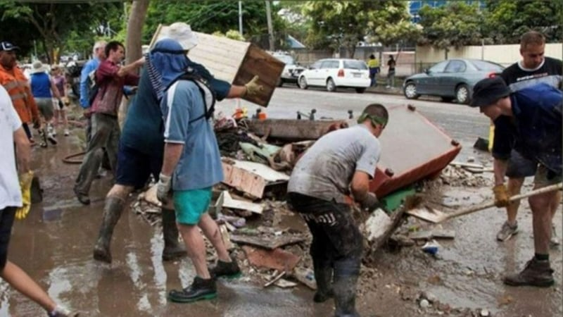 Volunteers clean up flooded homes in Ipswich, Australia