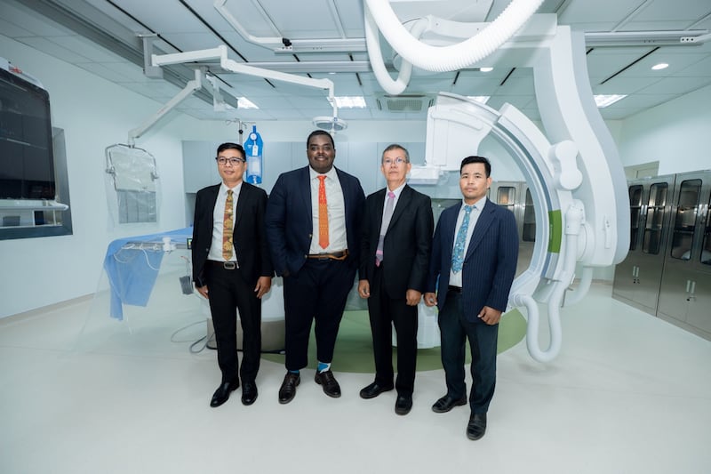 Local leaders of The Church of Jesus Christ of Latter-day Saints pause for a photo with the new X-ray system in the cath lab during the celebration for the heart center at the Siem Reap Provincial Referral Hospital in Siem Reap, Cambodia, on Feb. 26, 2026.