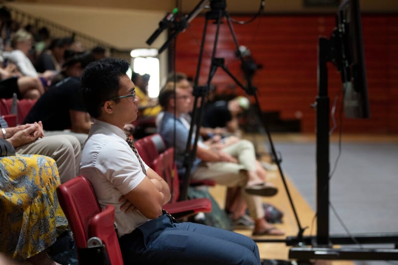 Students in the Cannon Activities Center listen as BYU–Hawaii President John S.K. Kauwe III speaks during a campus devotional in Laie, Hawaii, on Tuesday, May 3, 2022.