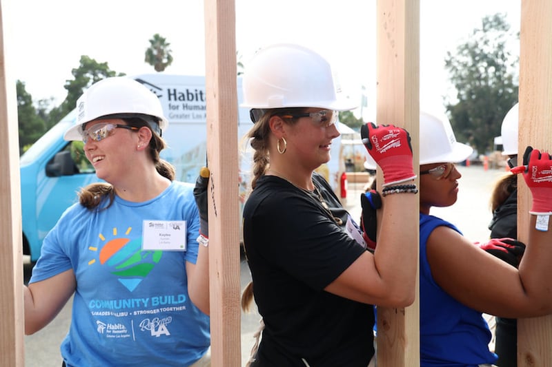 Volunteers at a Habitat for Humanity event work to rebuild homes destroyed during the Palisades Fire during a four day event in September 2026 in Los Angeles, California.