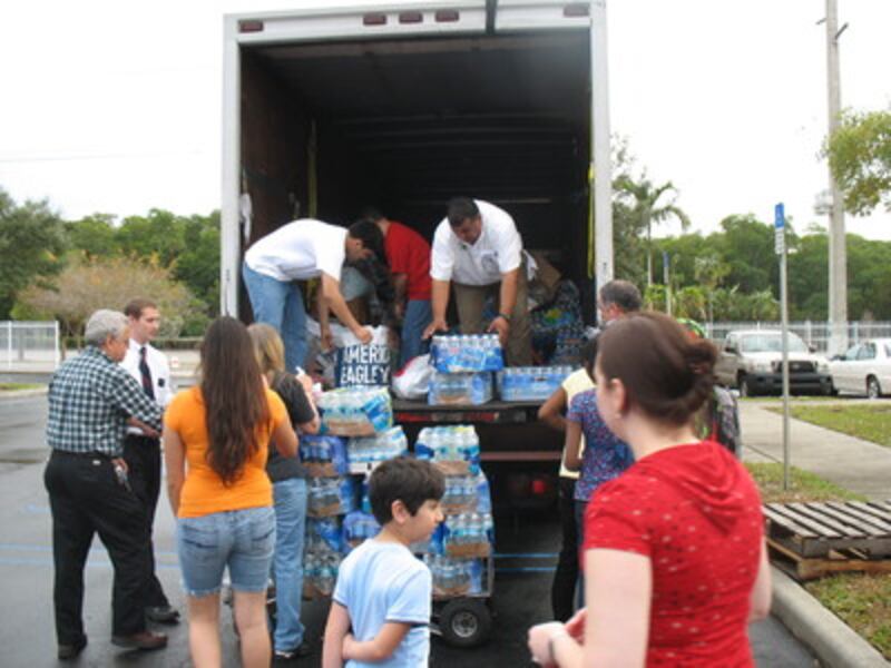 Volunteers unload a truck of supplies from Ft. Lauderdale.