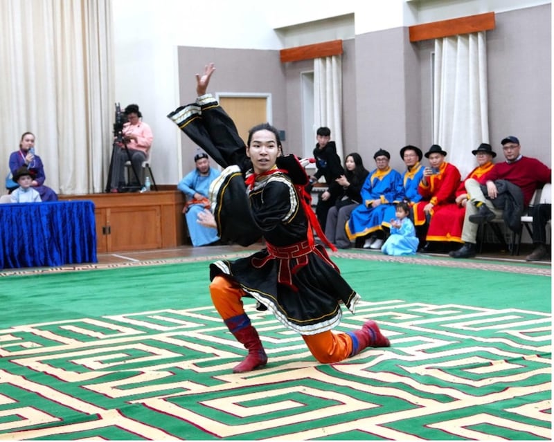 A young man performs a dance in traditional Mongolian dress during a Lunar New Year and family history celebration in Mongolia on Feb. 14, 2026.