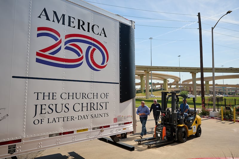Volunteers help unload boxes of food from delivered from The Church of Jesus Christ of Latter-day Saints to Joe's Food Pantry in Dallas, Texas, on Thursday, May 14, 2026.