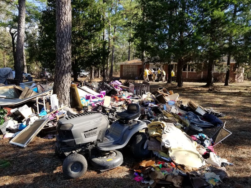 Mitch and Madie Mathews recently worked alongside fellow Helping Hands volunteers, removing waterlogged debris from a home in Wilmington, North Carolina.