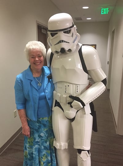 Sister Joyce Forman, a service missionary at the Church History Library, takes a photo with a Storm Trooper.