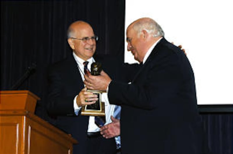 Pres. Robert Scott Lorimer, right, former president of the Riverton Wyoming Stake, is presented the