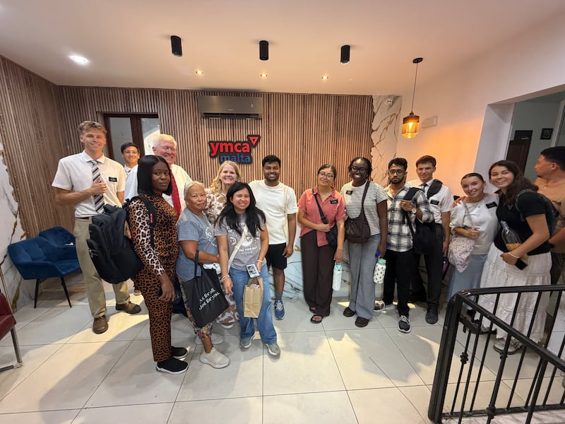 Young adult volunteers from The Church of Jesus Christ of Latter-day Saints gather with YMCA Malta representatives following an evening of service with children and families at a YMCA Malta family shelter in Malta on Aug. 1, 2026.