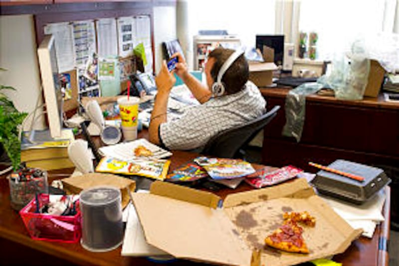 Unhealthy habits, as portrayed in this photo illustration, are causing a drop in workplace productiv