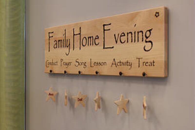 Family home evening, as signified by this assignment chart, was a subject of a booth sponsored by th