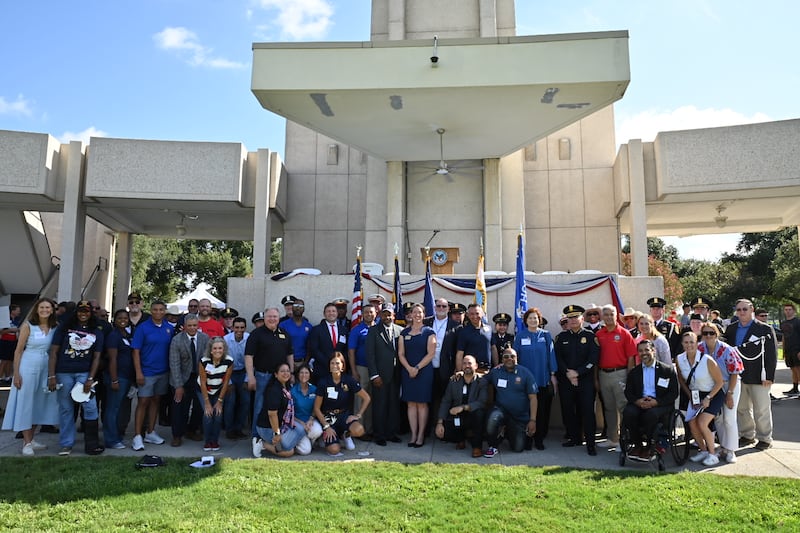 Volunteers pose for a photo along with community and faith leaders at a National Day of Service and Remembrance event in Houston, Texas, at the Houston National Cemetery, on Saturday, Sept. 12, 2026.