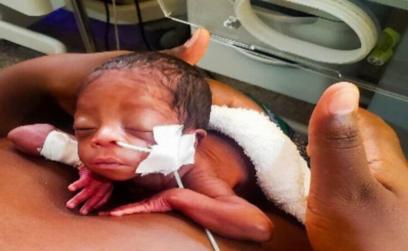 A newborn baby rests skin-to-skin on his mother's chest days after being born prematurely at the Lewanika General Hospital in Western Province, Zambia, in December 2024.