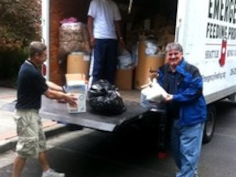Loading the emergency feeding truck.