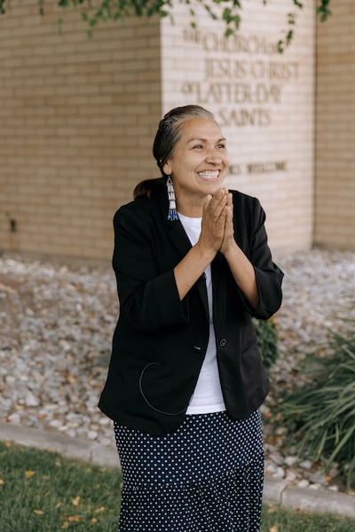 Andrea Beyta speaks with news media outside the Spokane Washington North Stake Center following a special multi-stake meeting in Spokane, Washington, on Sunday, Aug. 23, 2026.