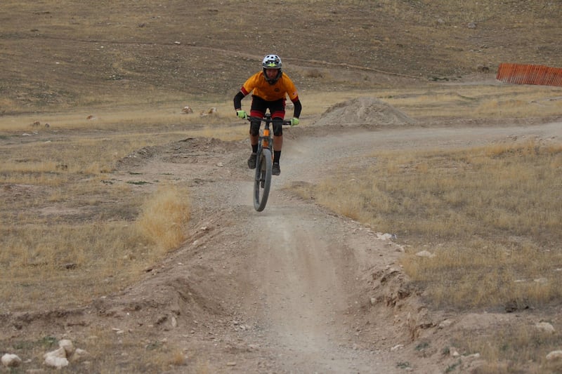 Preston Page rides a mountain bike.
