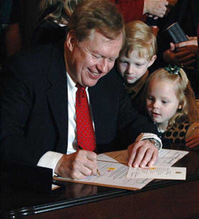 Robert R. King, U.S. Ambassador/Special Envoy for North Korean human rights issues, signs documents