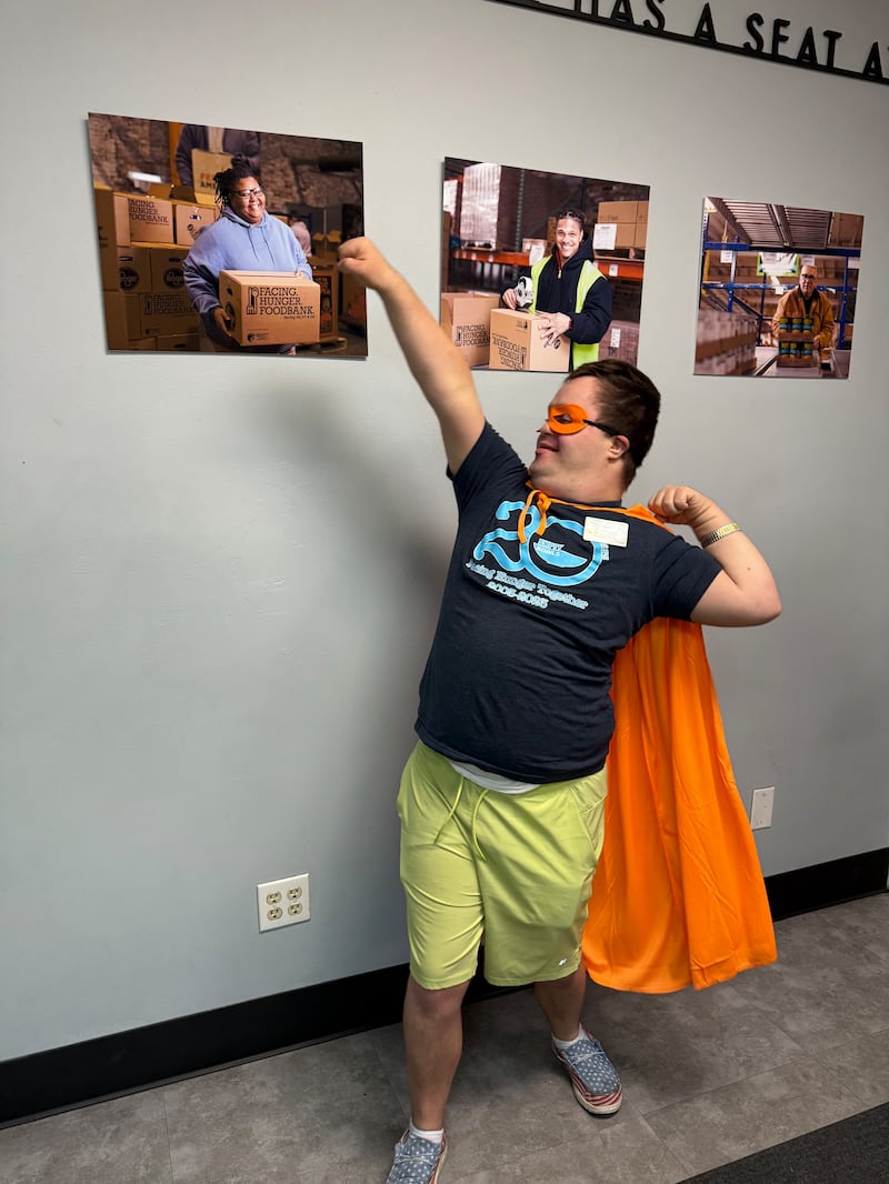 Elder Nathan Welch poses with his cape at the Facing Hunger Food Bank in Huntington, West Virginia. Elder Welch began his missionary service in June 2024 and will conclude in June 2026.