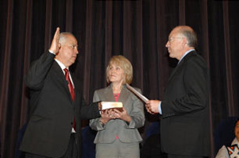 Larry EchoHawk, left, his wife Terry EchoHawk, center, and Secretary of the Interior Ken Salazar at