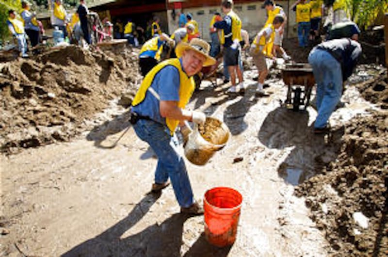 Grant Christensen, 79, was among the oldest volunteers helping clean up after mudslides. Other volun