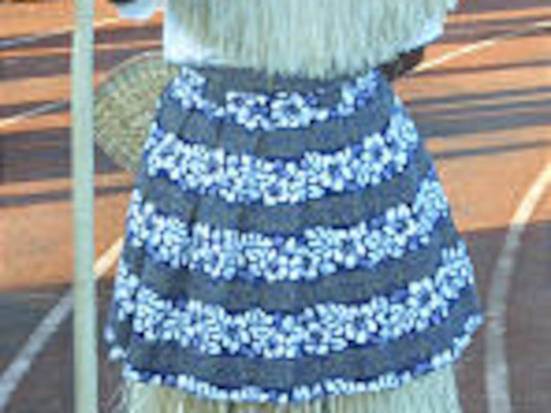 Actor dressed in Fijian regalia strikes a dramatic pose. Above, thousands of dancers spent months pr