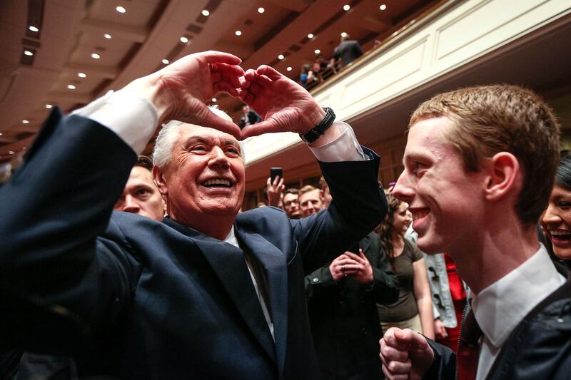 Elder Dieter F. Uchtdorf makes a heart shape with his hands to the devotional goers as he exits through the main seating area after the World Wide Devotional for Young Adults hosted by Elder Dieter F. Uchtdorf at the Conference Center in Salt Lake Sunday, Jan. 14, 2018.