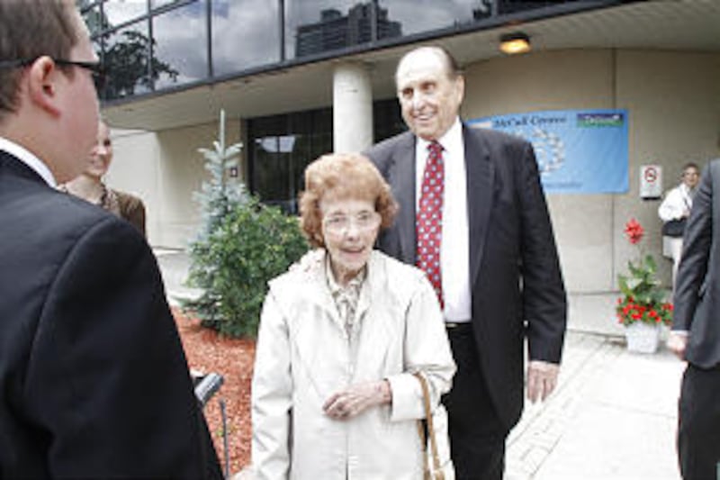 President Thomas S. Monson accompanies Dorothy Davies to visit her husband, Pat Davies, at a care c