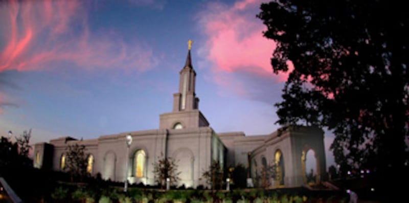 The Sacramento California Temple's spire is accented by a colorful sunset. President Gordon B. Hinck