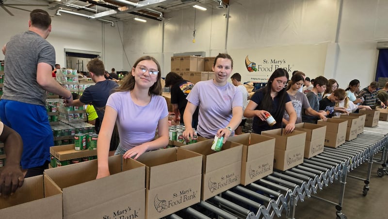 Youth put together boxes of donated food at St. Mary's Food Bank, in Phoenix, Arizona for Global Youth Service Day on Saturday, April 18, 2026.