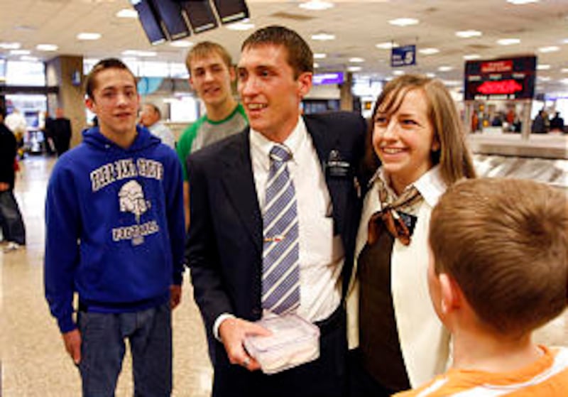Kevin and Breanne Hawkins see their family for the first time as they return home from their mission