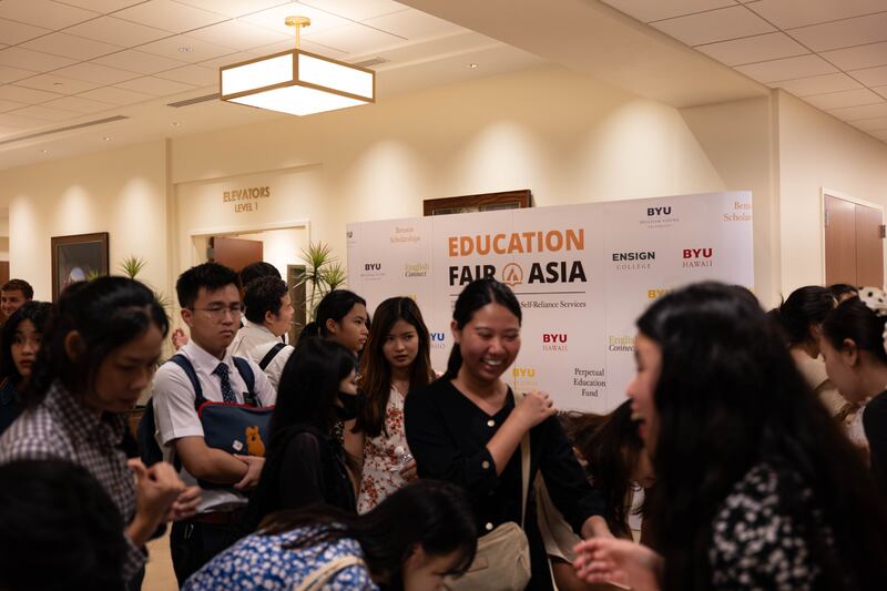 Participants flock to the registration table for the Asia Area education fair held in Bangkok, Thailand, Oct. 19, 2025.