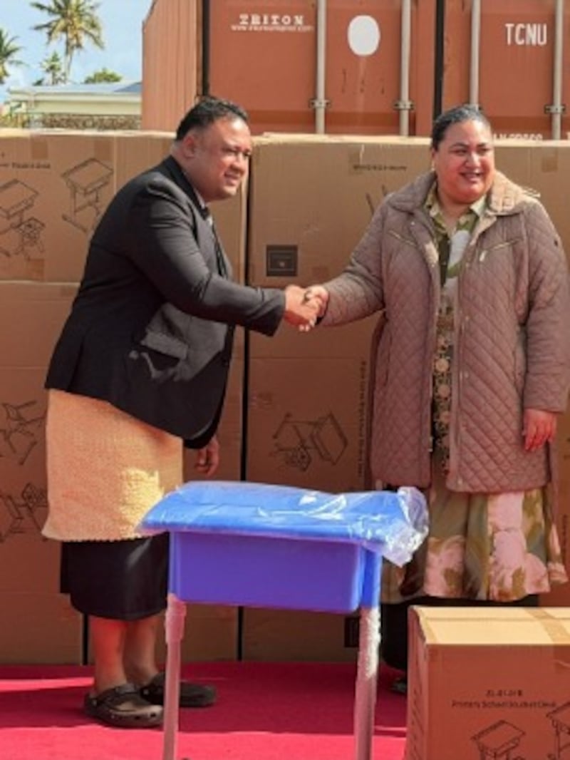 A stake president presents a donation of school desks and chairs to Her Royal Highness Crown Princess of Tonga Sinaitakala Tuku'aho in ʻApi Mataka, Tonga, July 16, 2026.