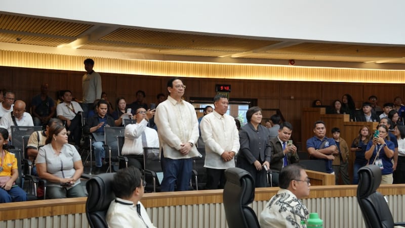 Elder Carlos G. Revillo Jr., Rizaldito Castro and Haidi Fajardo stand during a Davao City Council meeting in Davao, Philippines, on March 24, 2026.