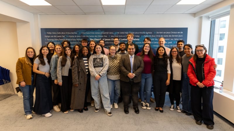 Participants at the Brussels Nexus Conference smile inside the European and International Office of The Church of Jesus Christ of Latter-day Saints in Brussels, Belgium, May 14, 2026.