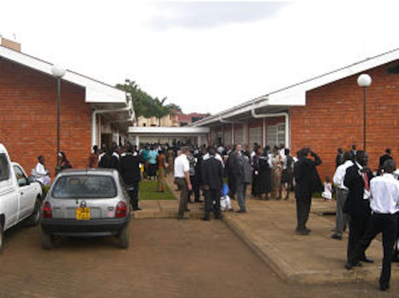 More than an hour after the new Kampala Uganda Stake was created, members gather outside their meeti