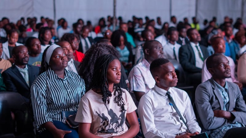 Young single adults attend a devotional with Elder Gerrit W. Gong in Beira, Mozambique, on May 19, 2026.