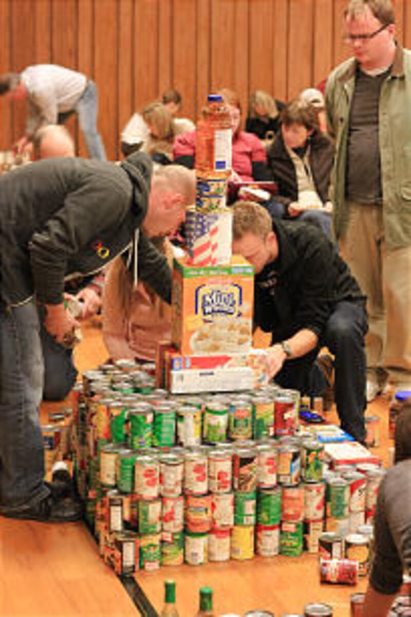 Members from the Sandy YSA Stake build gospel-themed canned food sculptures. Overall, the stake dona