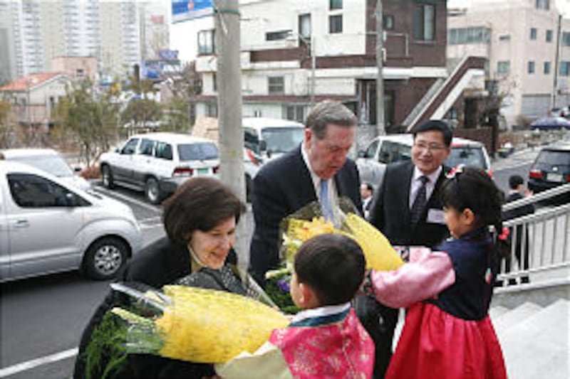 Elder Jeffrey R. Holland and his wife, Sister Patrica Holland, are greeted in Korea.