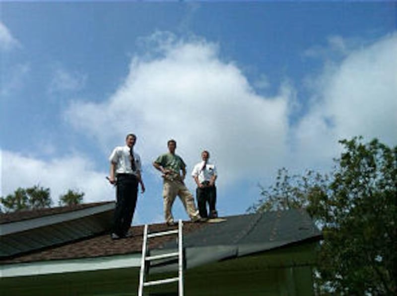 Missionaries in North Carolina help repair a roof after Hurricane Irene struck the east coast on Aug