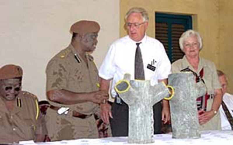 Elder Neil Darlington, center, and Sister Marjorie Darlington, LDS Charities missionaries, talk with
