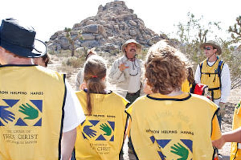 At Joshua Tree National Park, volunteer ranger Dave Henley gives youth from the Onaga Trail Ward of