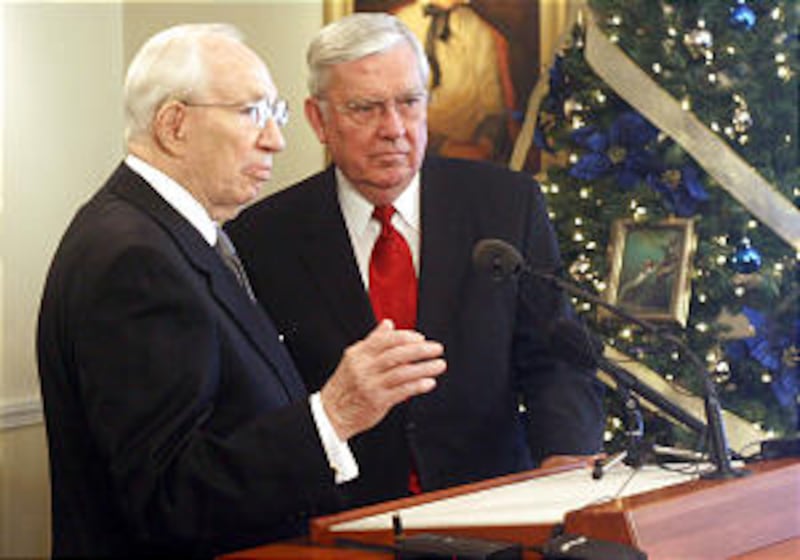 President Gordon B. Hinckley, left, and Elder M. Russell Ballard speak to members of the media durin
