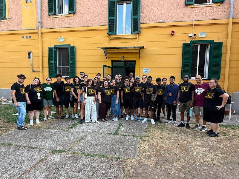 Young single adults from Sicily and Malta gather with others involved in the service project outside Casa Scalabrini 634 in Rome, Italy.