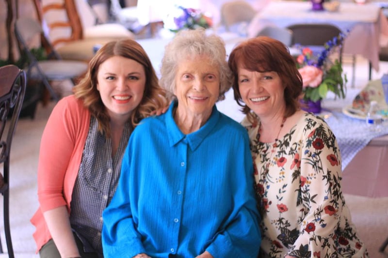 Three generations of women smile together -- Tammy Simister Robinson with her mother, Louise, and her daughter Olivia.