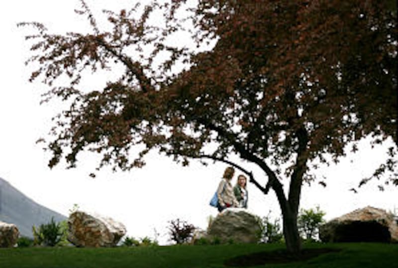 Conferencegoers attending the annual BYU Women's Conference stroll along pleasant paths on their way