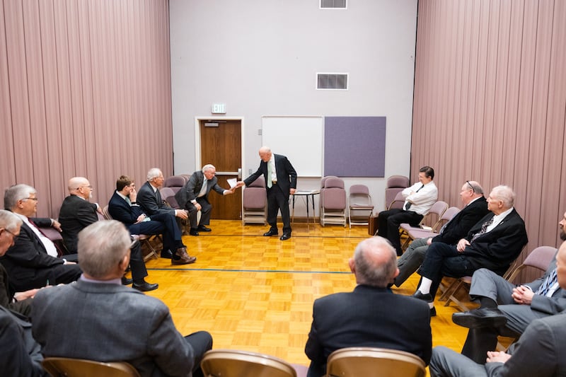 President Cleeo Wright hands out a photo.