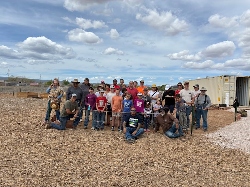 Youth and adults helping at the Community Pantry and Hope Garden smile for a photo after working to prepare new gardens in Grants, New Mexico, on April 11, 2026.