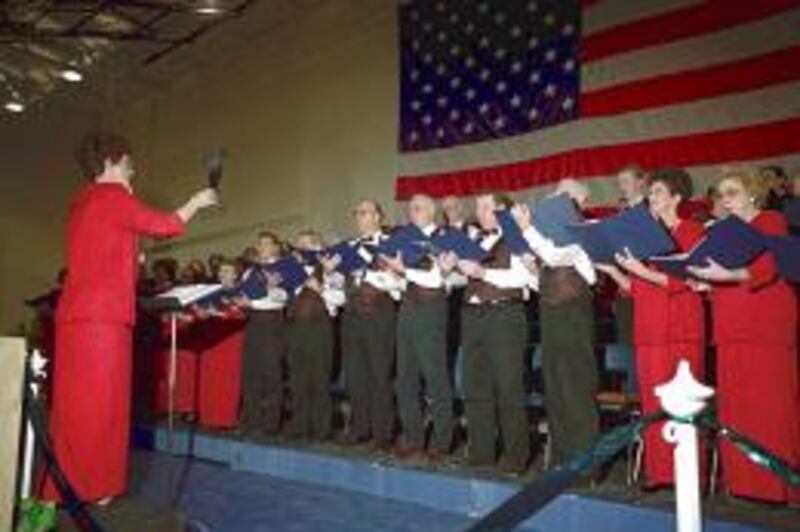 Ramona Stubbs directs Parowan Community Chorus at annual town meeting at sesquicentennial of city.