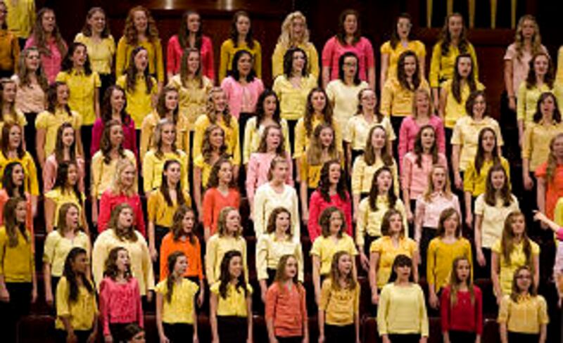 The choir sings during the meeting as thousands of young women attend general Young Women's meeting