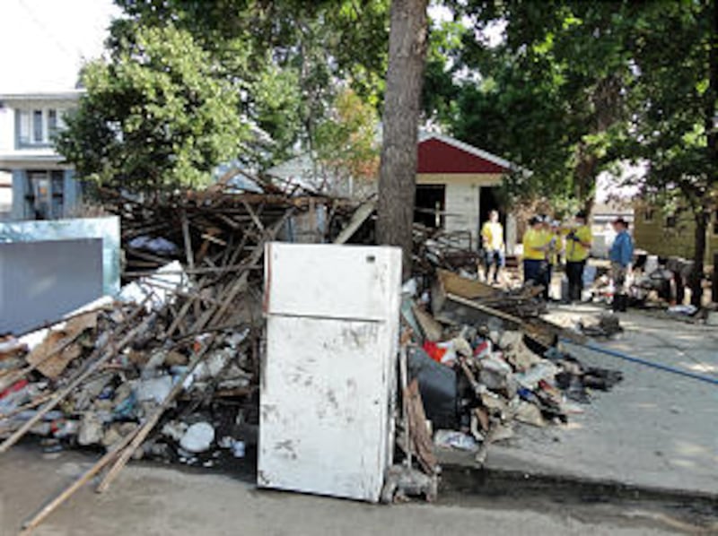 Piles of debris are prevalent along the streets of many neighborhoods in North Dakota because of flo