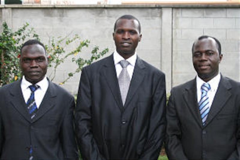 Kampala Uganda Stake presidency: center, Jimmy Carter Okot, president; left, Charles Ssekirangi, fir